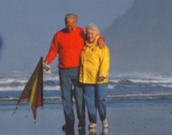 Photo of couple strolling on the beach